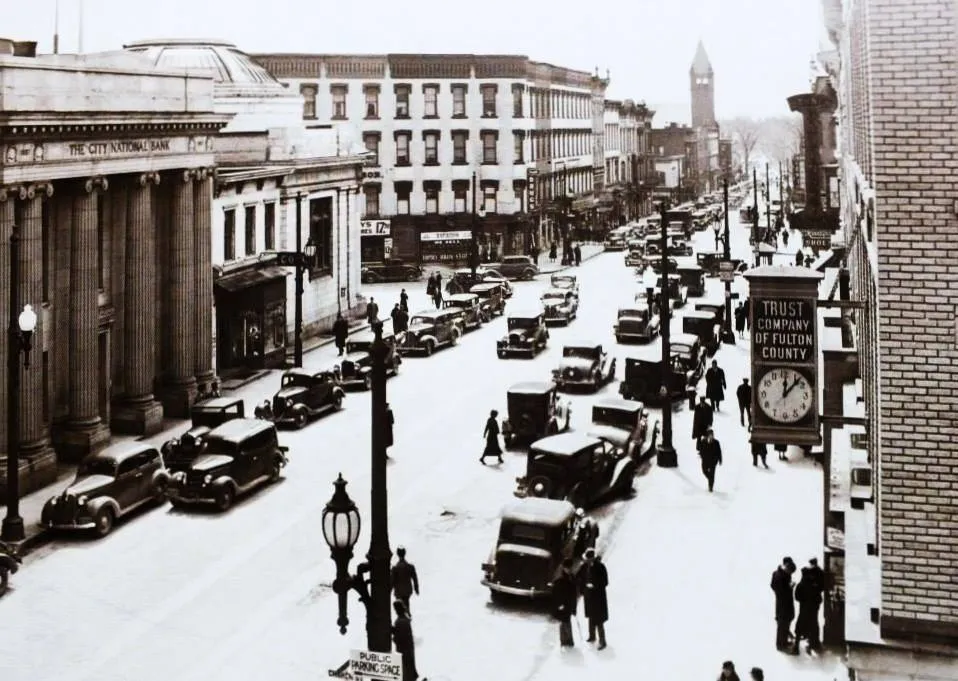 Black and white photo of the four Corners of Gloversville looking south from Church St 1940